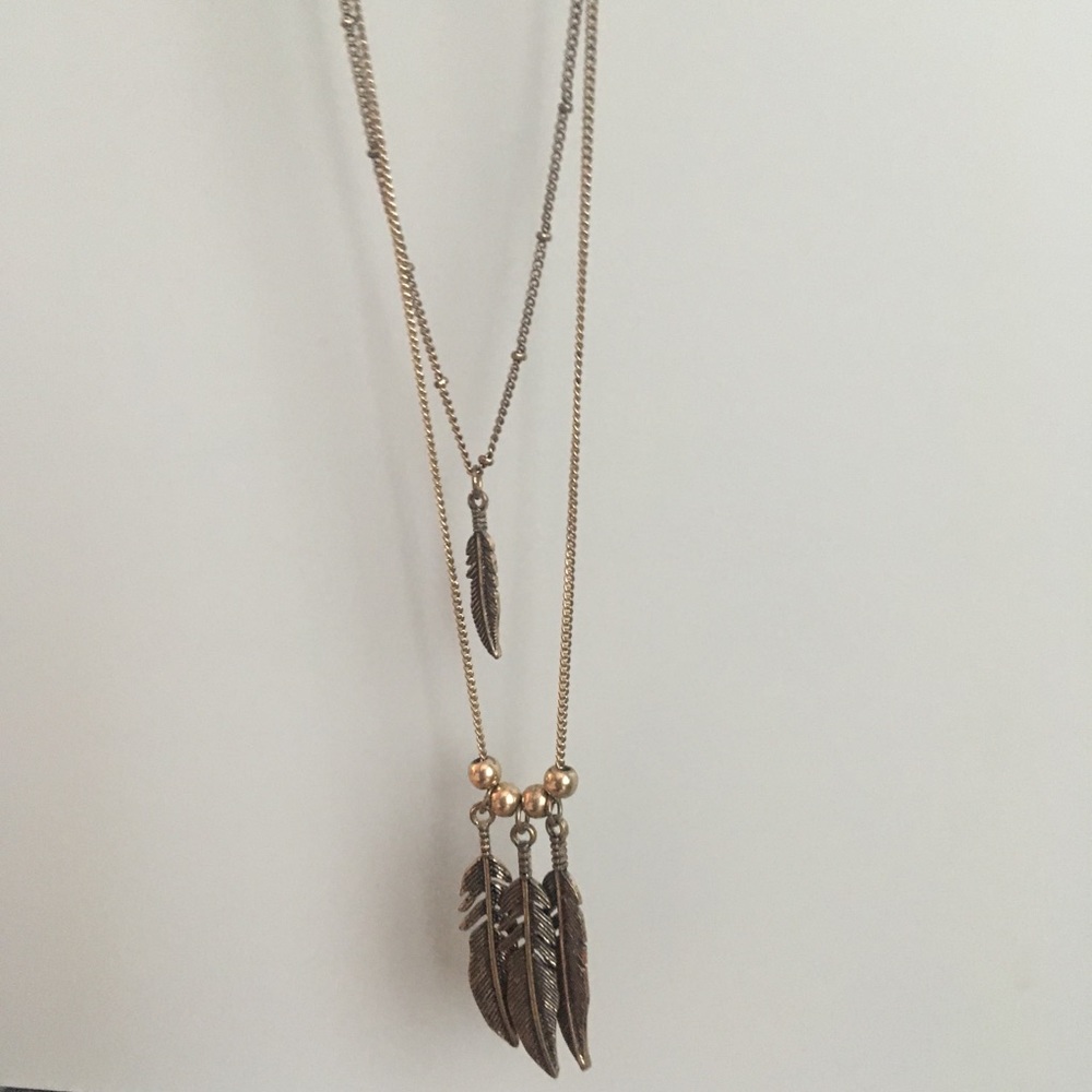 Layered feather necklace.